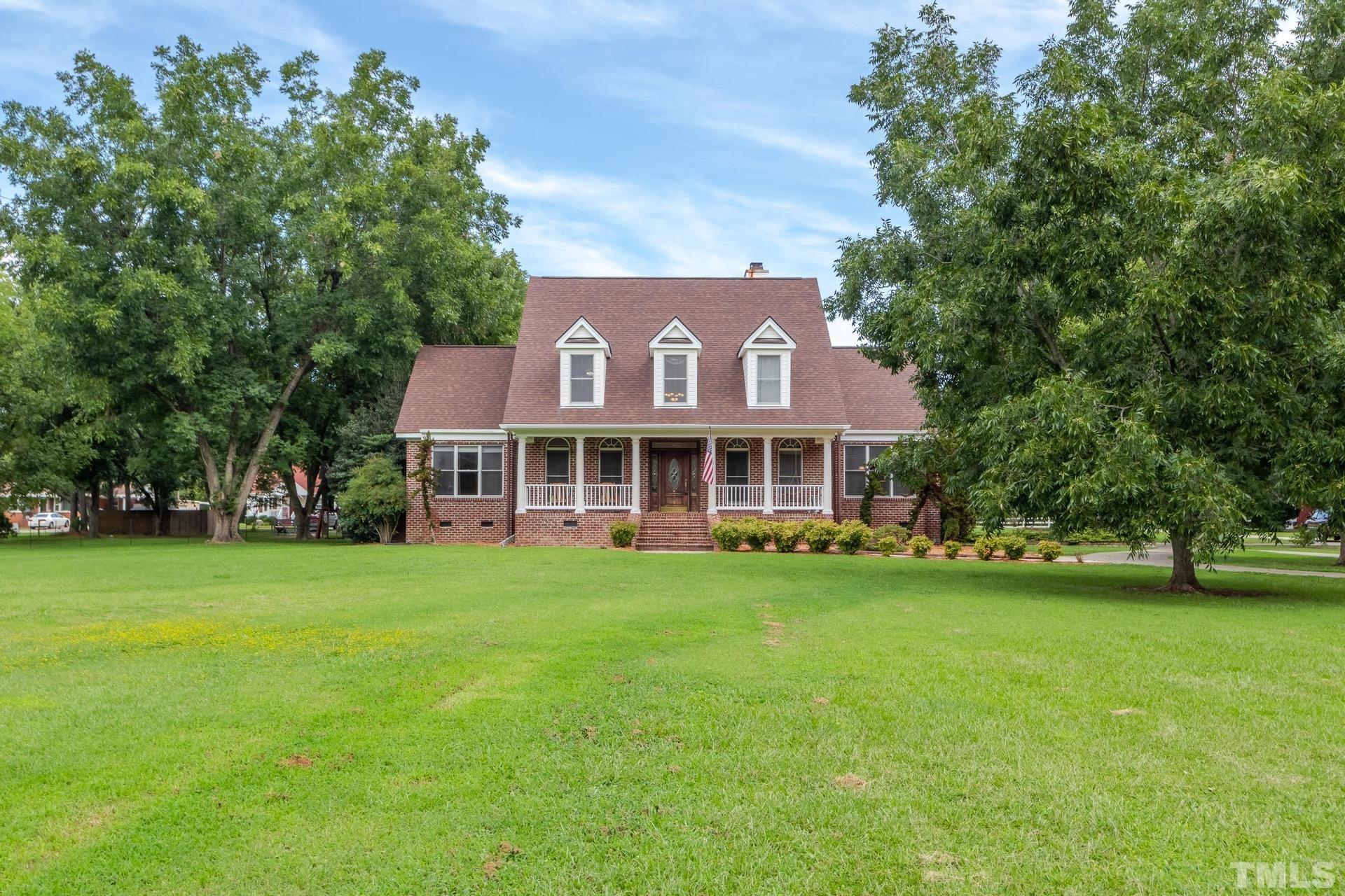 2213 East Garner Road Raleigh, NC 27610 - Photo 2 of 74 a view of a house with a big yard
