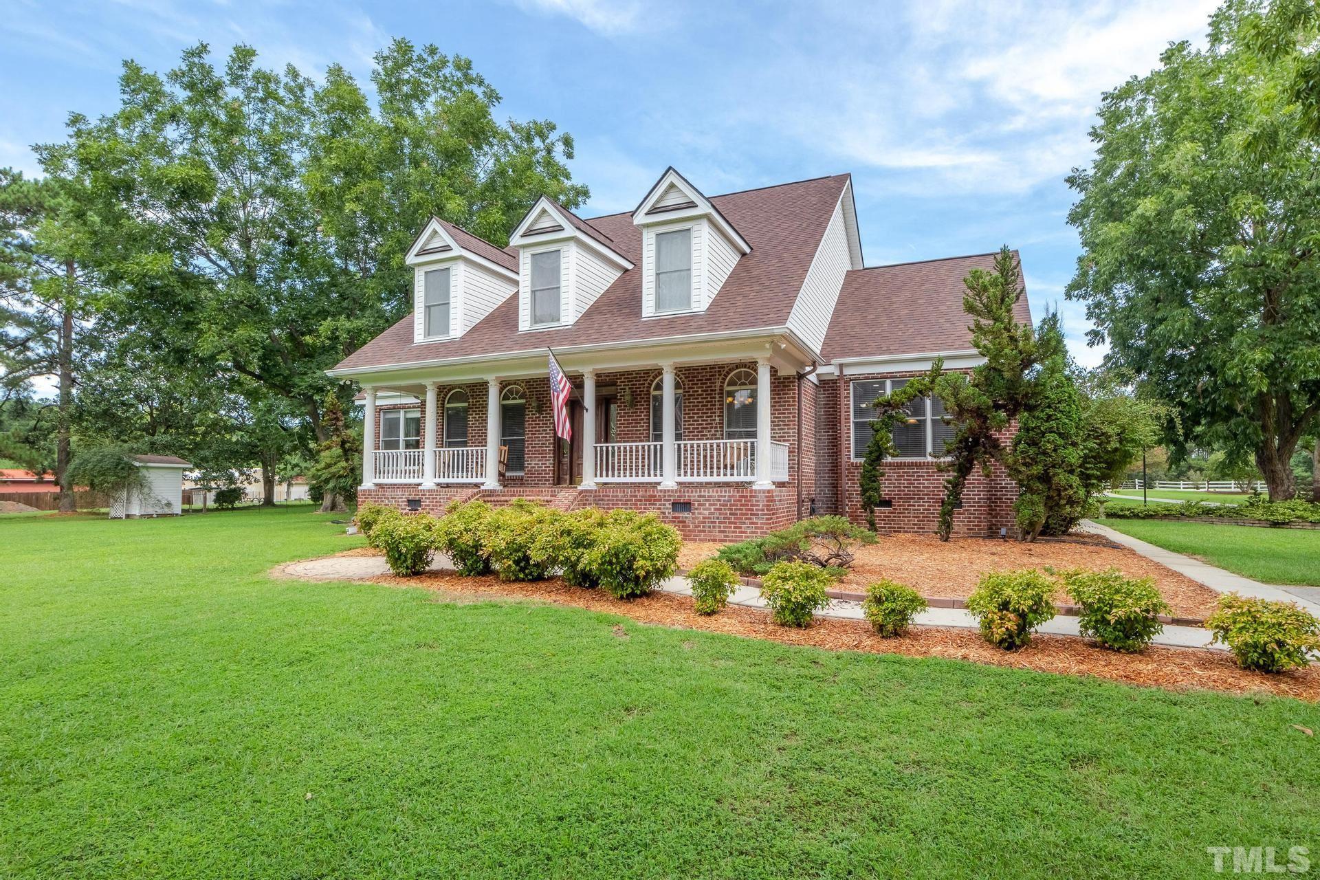 2213 East Garner Road Raleigh, NC 27610 - Photo 4 of 74 front view of a house with a garden