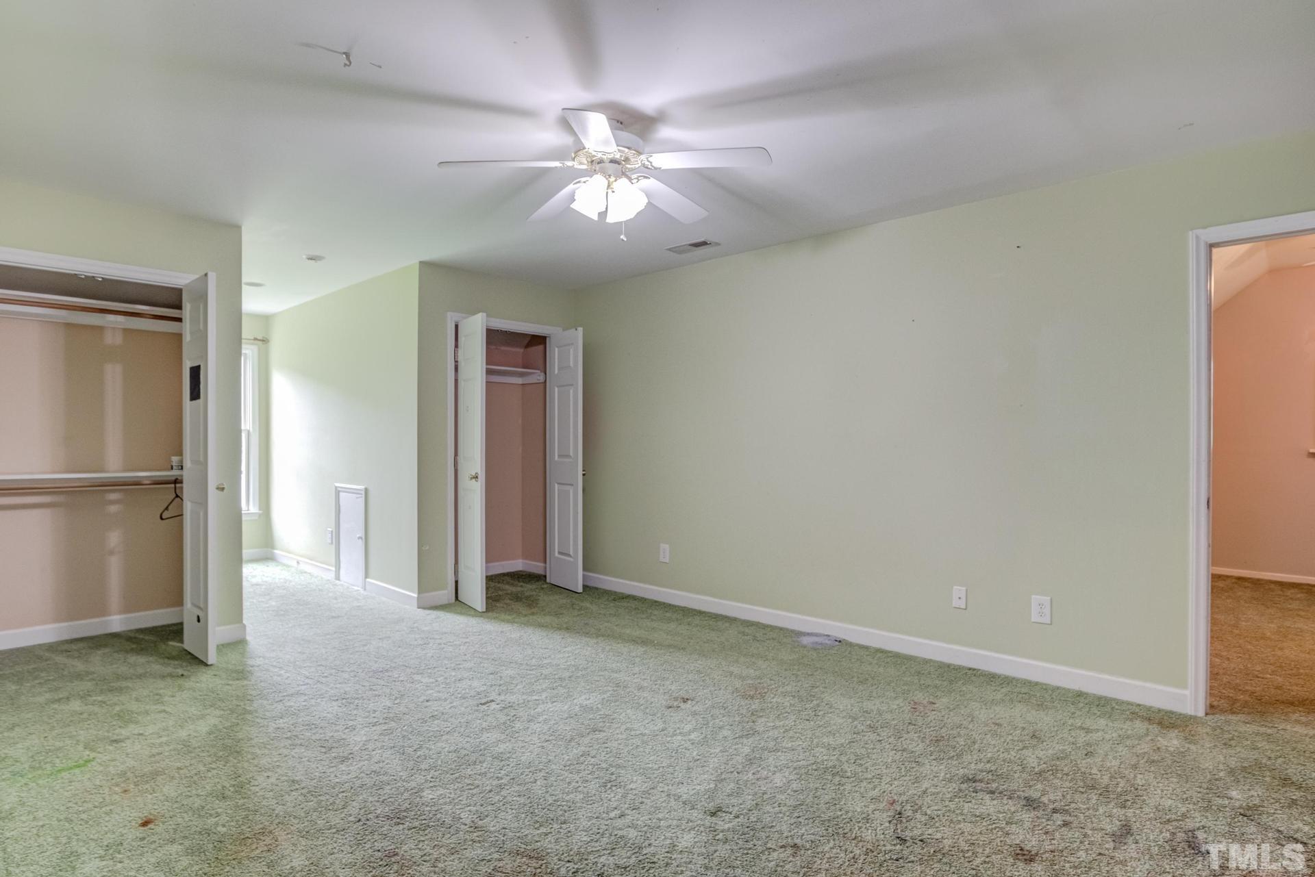 2213 East Garner Road Raleigh, NC 27610 - Photo 50 of 74 a view of an empty room with a chandelier fan