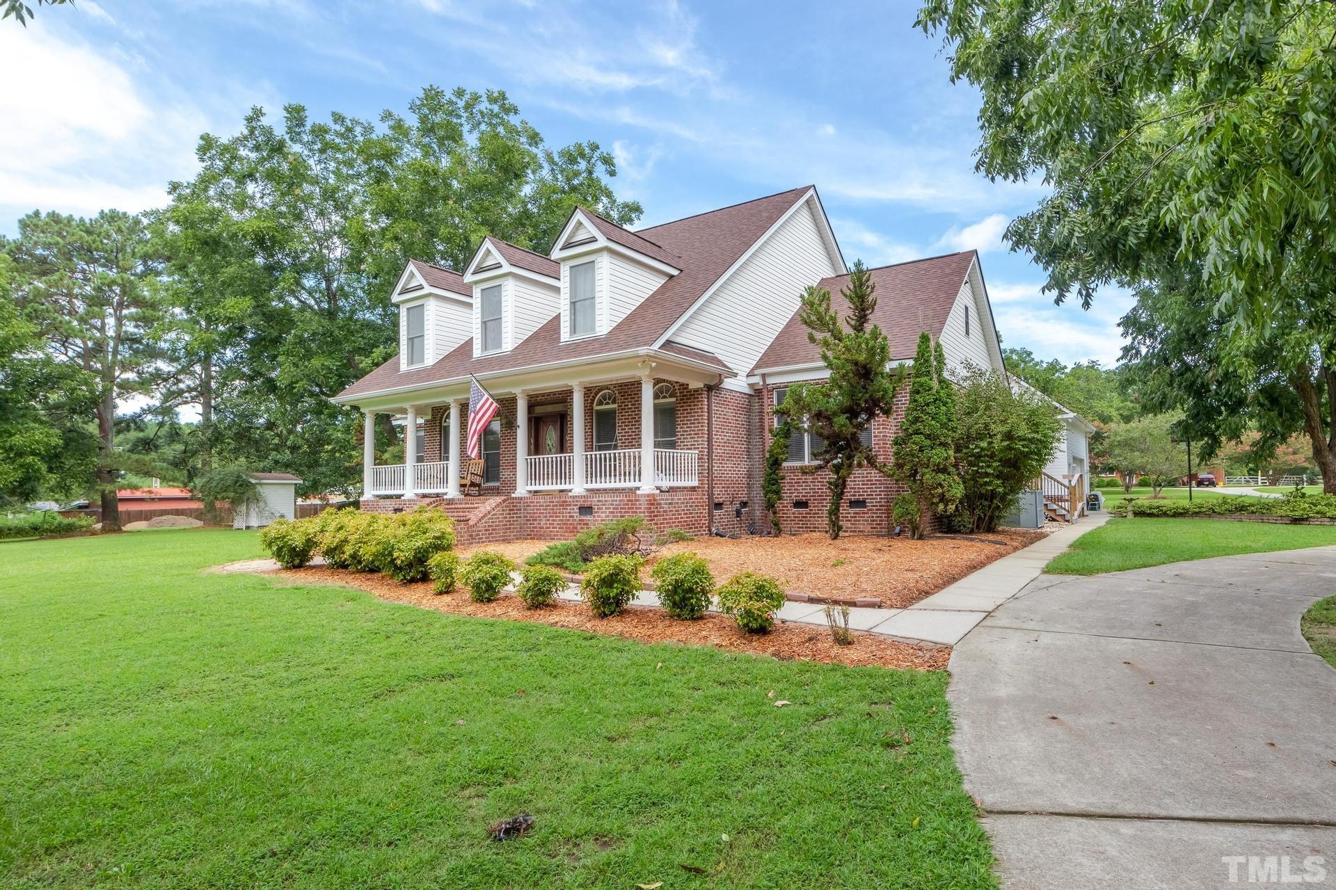 2213 East Garner Road Raleigh, NC 27610 - Photo 5 of 74 a front view of a house with a yard