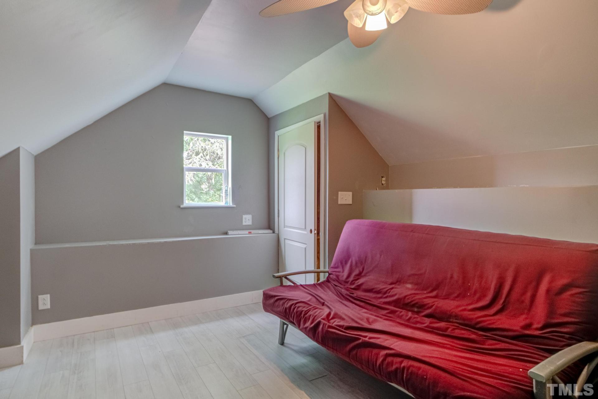 2213 East Garner Road Raleigh, NC 27610 - Photo 57 of 74 a bedroom with a bed and a window