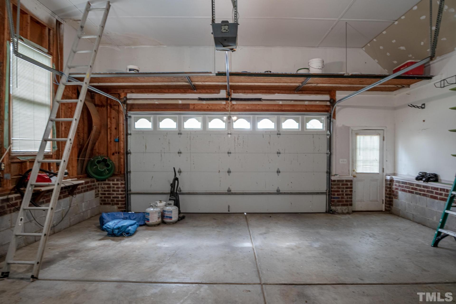 2213 East Garner Road Raleigh, NC 27610 - Photo 61 of 74 a view of empty room with wooden floor and fan