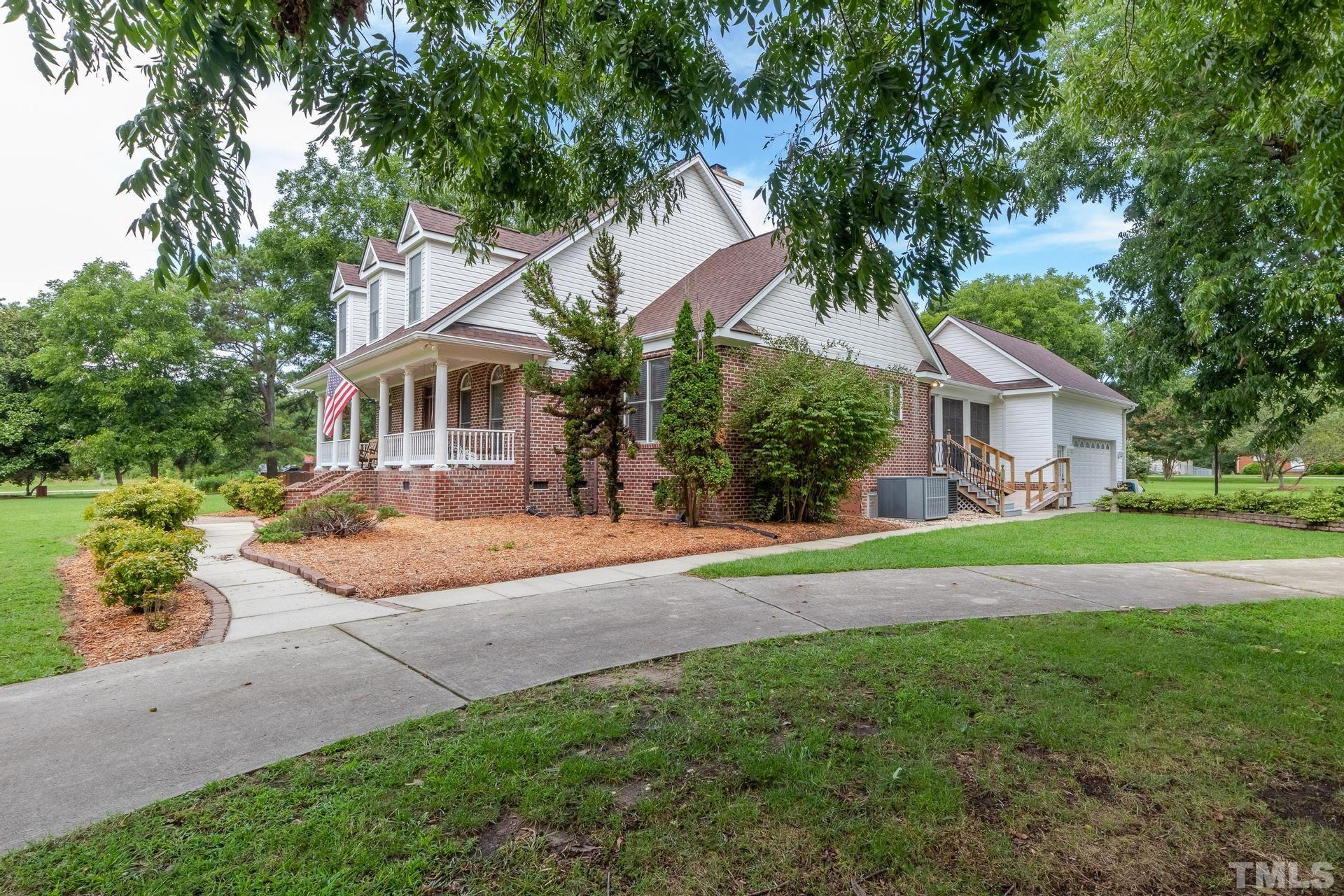2213 East Garner Road Raleigh, NC 27610 - Photo 7 of 74 a house view with a garden space