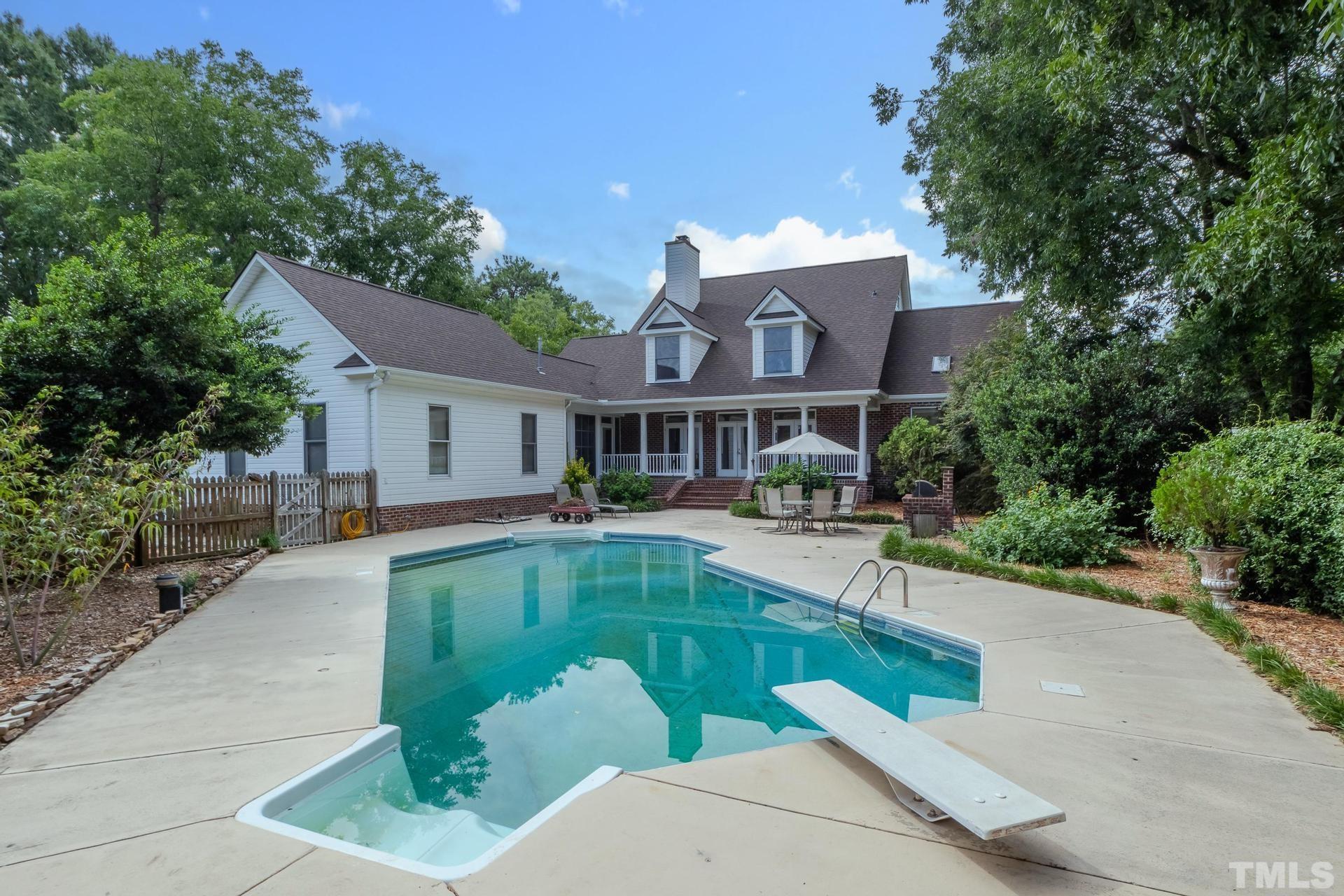 2213 East Garner Road Raleigh, NC 27610 - Photo 72 of 74 a house with swimming pool in front of it