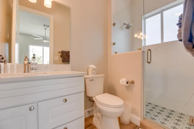 an aerial view of a house with swimming pool garden and outdoor seating