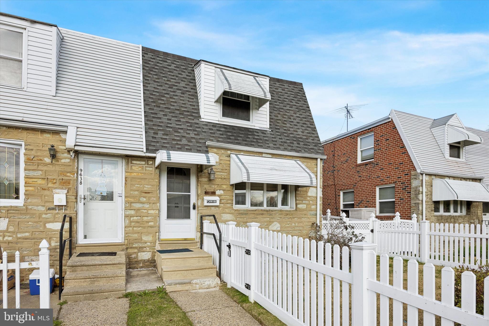 9640 Convent Avenue Philadelphia, PA 19114 - Photo 1 of 15 a front view of a house with large windows