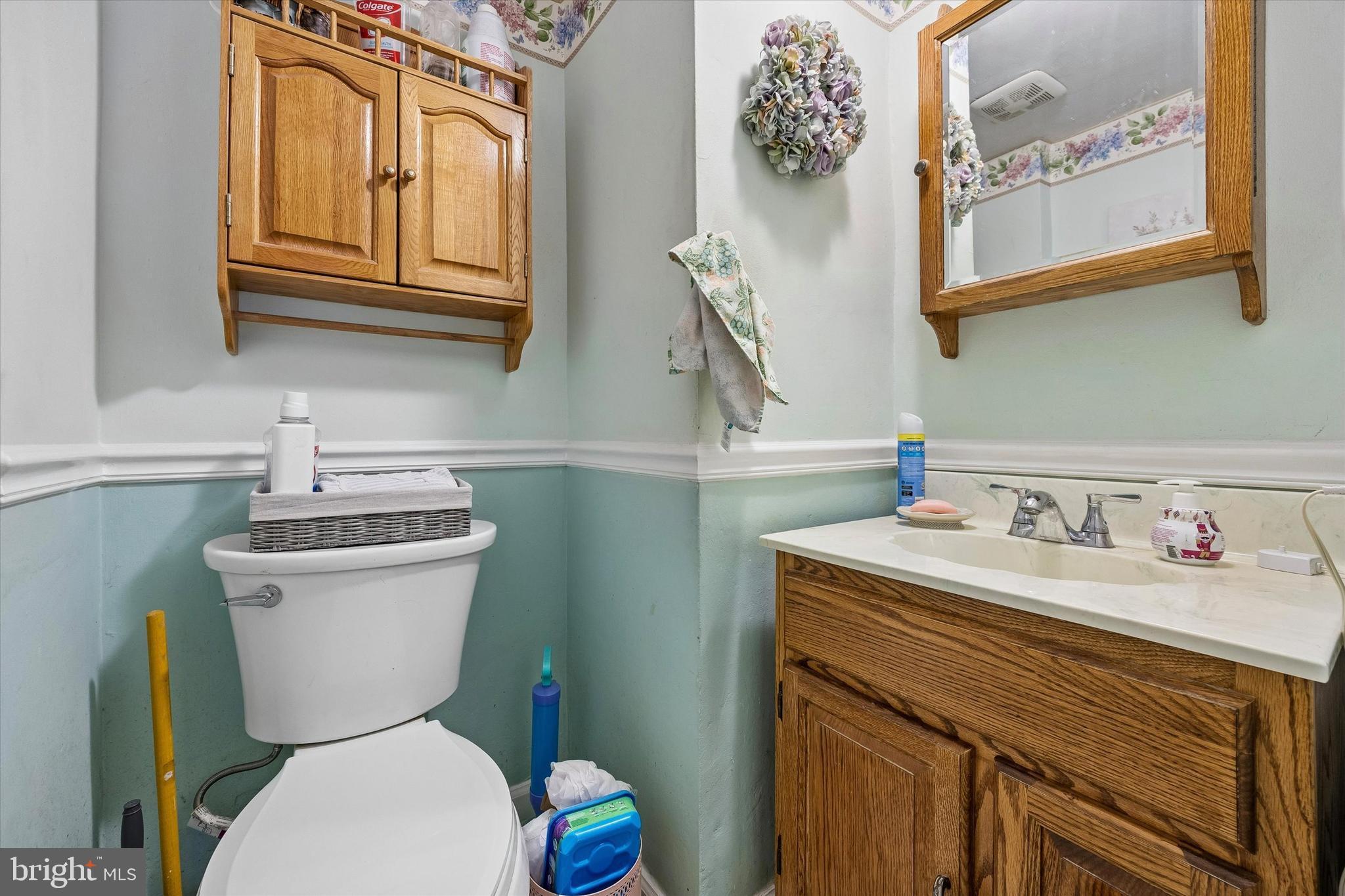 9640 Convent Avenue Philadelphia, PA 19114 - Photo 13 of 15 a bathroom with a toilet sink and mirror