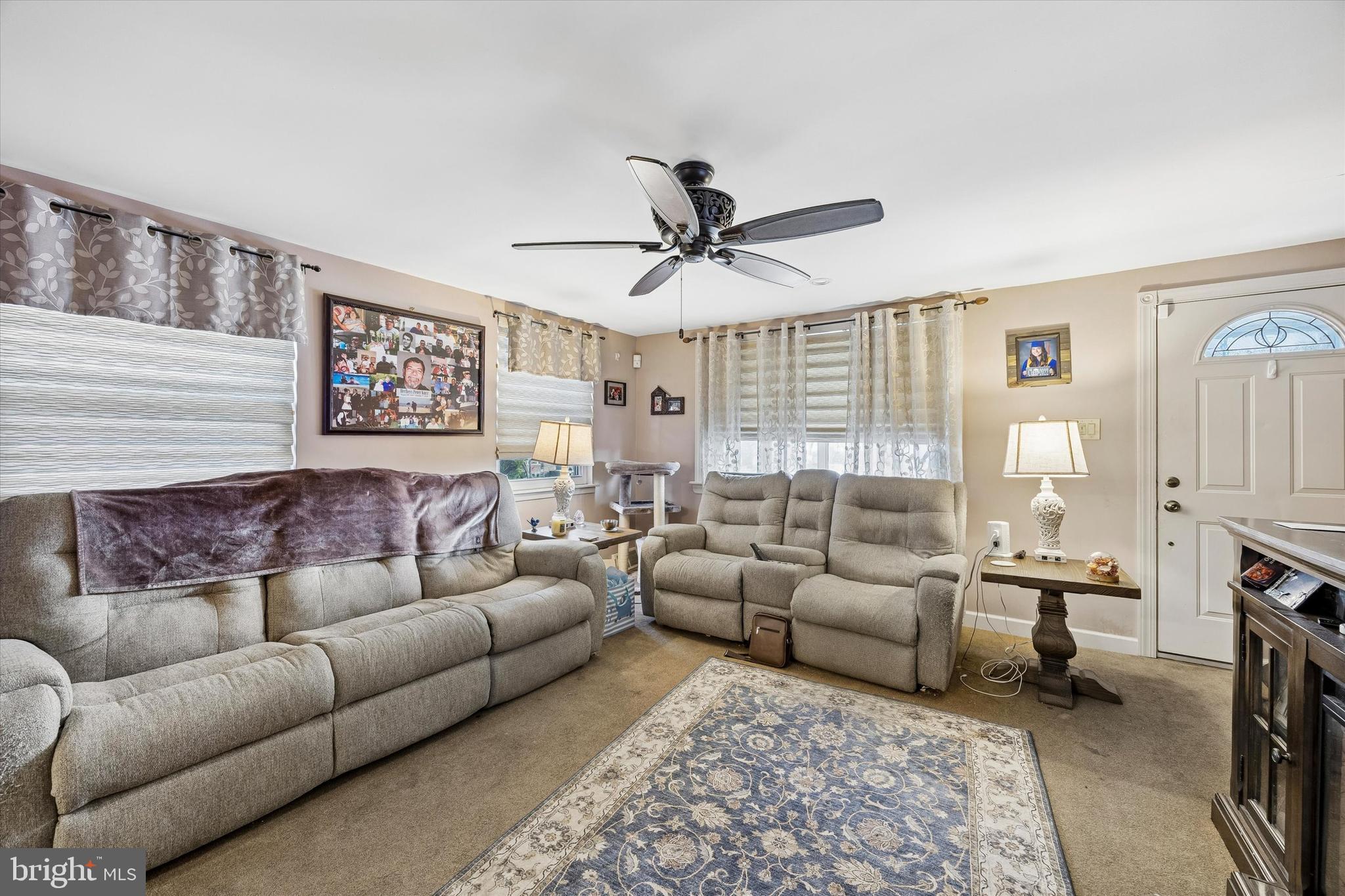 9640 Convent Avenue Philadelphia, PA 19114 - Photo 3 of 15 a living room with furniture ceiling fan and a rug