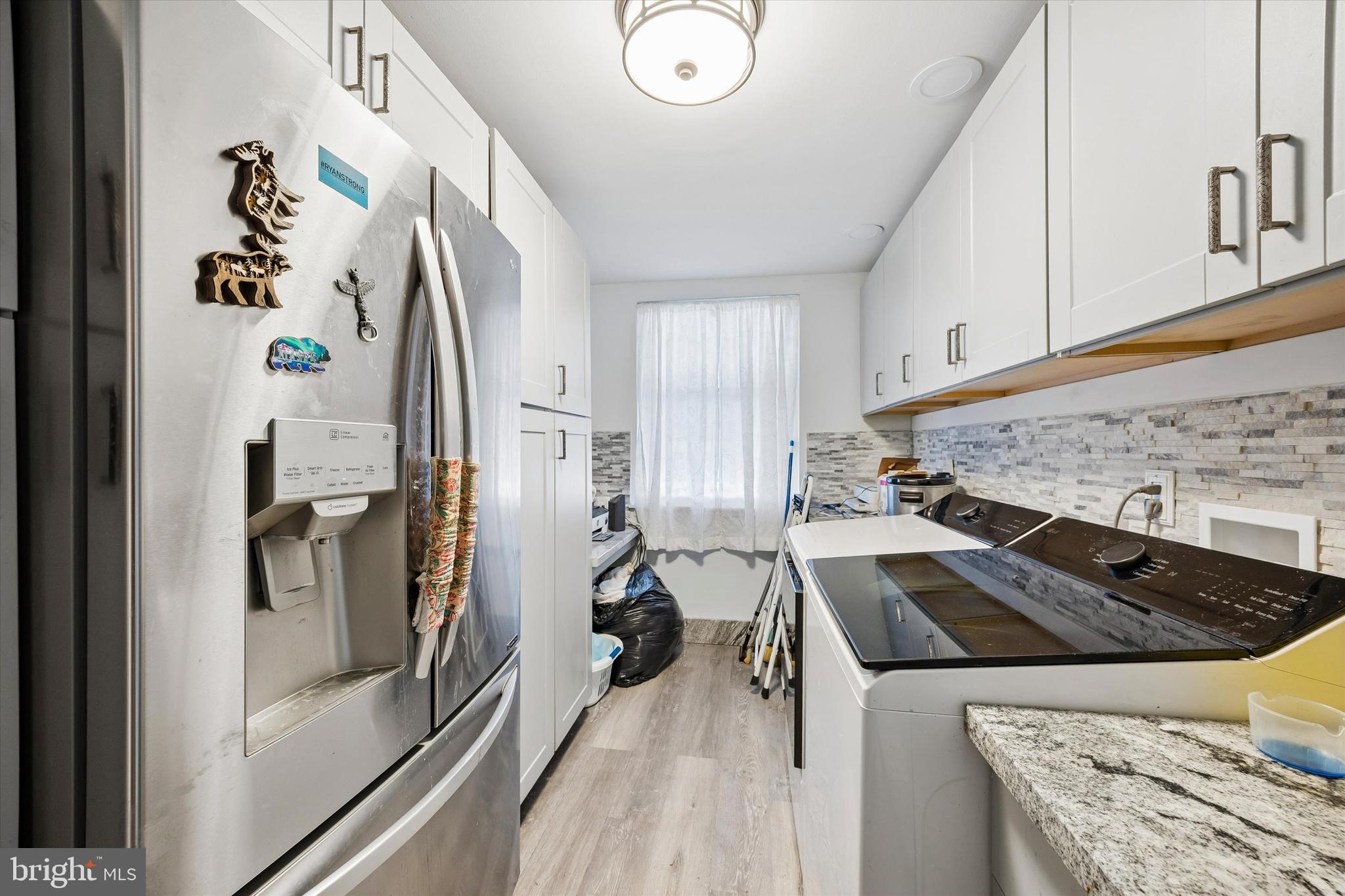 9640 Convent Avenue Philadelphia, PA 19114 - Photo 7 of 15 a kitchen with a stove and a refrigerator