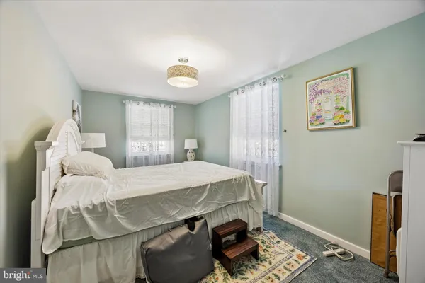 a bed room with a bed and a window