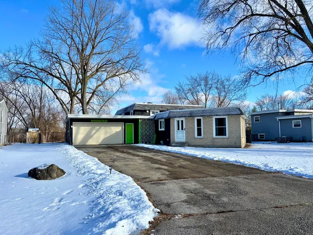 a front view of a house with yard