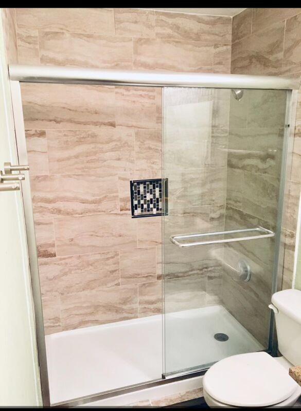 5708 Spring Meadow Road, Unit B Austin, TX 78744 - Photo 8 of 23 Bathroom featuring a stall shower and toilet