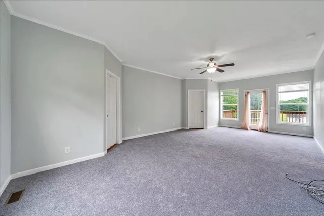 a bedroom with a bed and chair