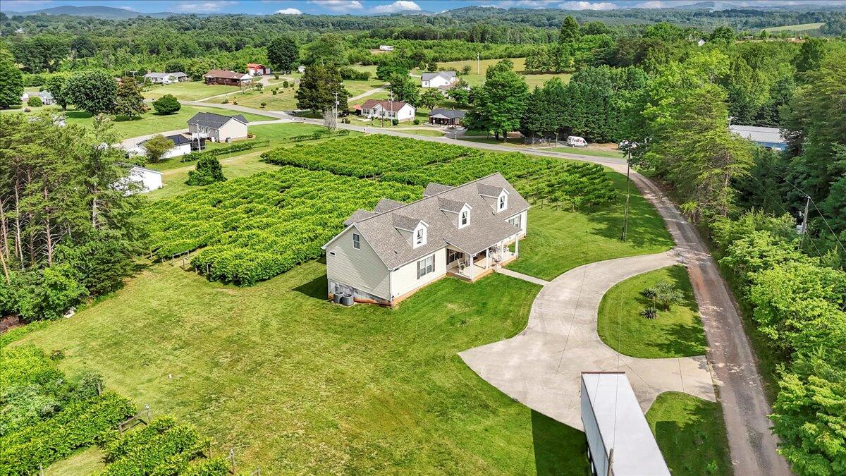 60 Tara Drive Ridgeway, VA 24148 - Photo 2 of 93 an aerial view of residential houses with outdoor space and trees