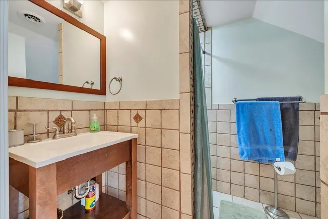 a aerial view of a house with a yard and sitting area