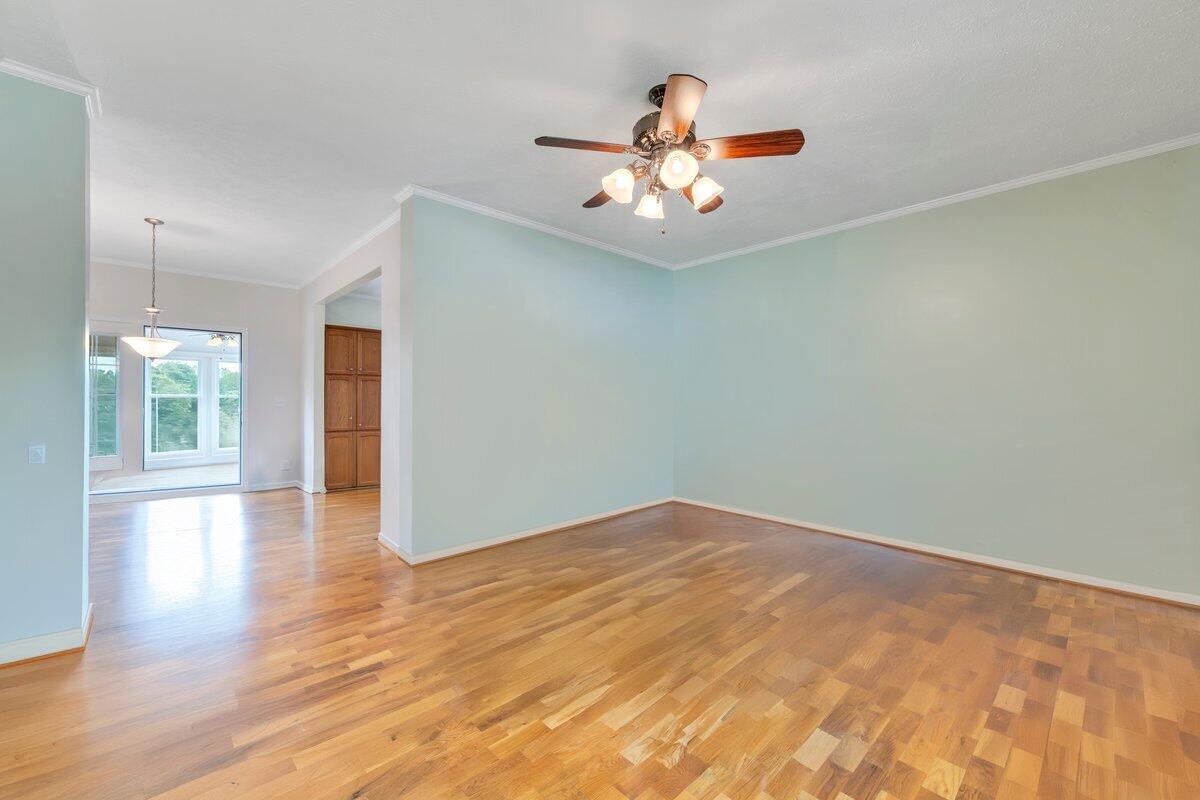 60 Tara Drive Ridgeway, VA 24148 - Photo 4 of 93 a view of an empty room with wooden floor and a window
