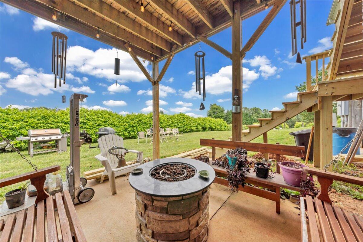 60 Tara Drive Ridgeway, VA 24148 - Photo 45 of 93 a view of a patio with a table chairs and a swimming pool