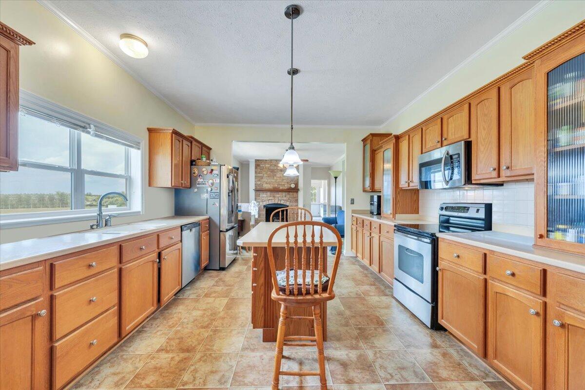 60 Tara Drive Ridgeway, VA 24148 - Photo 5 of 93 a kitchen with cabinets a sink and a stove