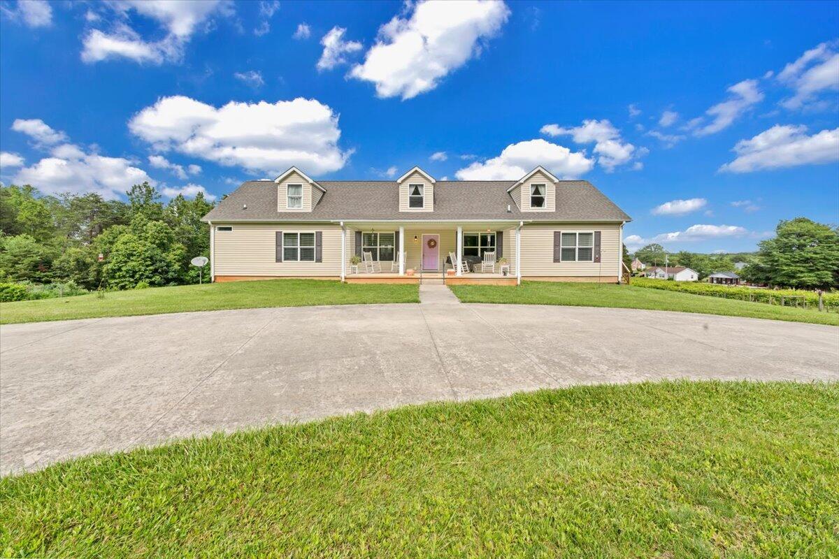 60 Tara Drive Ridgeway, VA 24148 - Photo 59 of 93 a front view of a house with a garden and yard