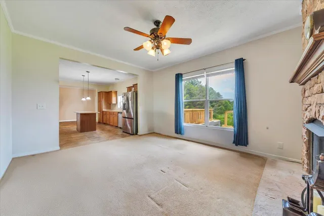 a view of a room with a sink and wooden floor