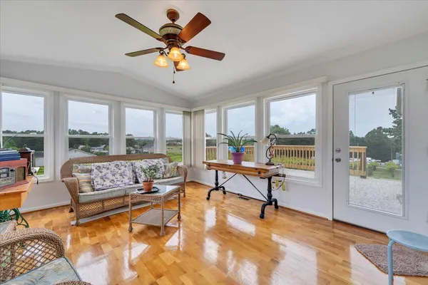 a spacious bedroom with a bed and a chandelier