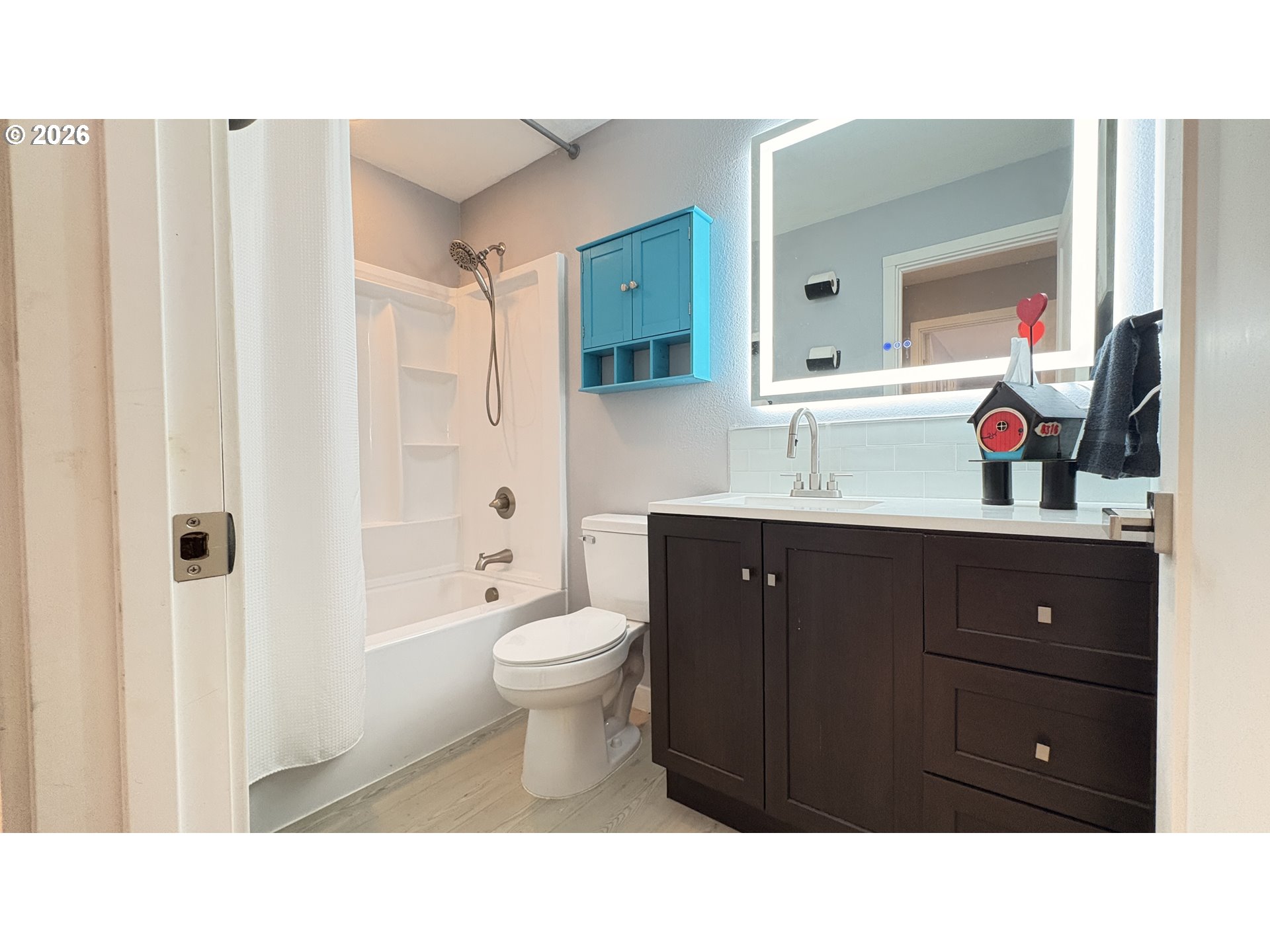 6650 Southwest Canby Street Portland, OR 97223 - Photo 23 of 34 a bathroom with a sink vanity mirror and toilet