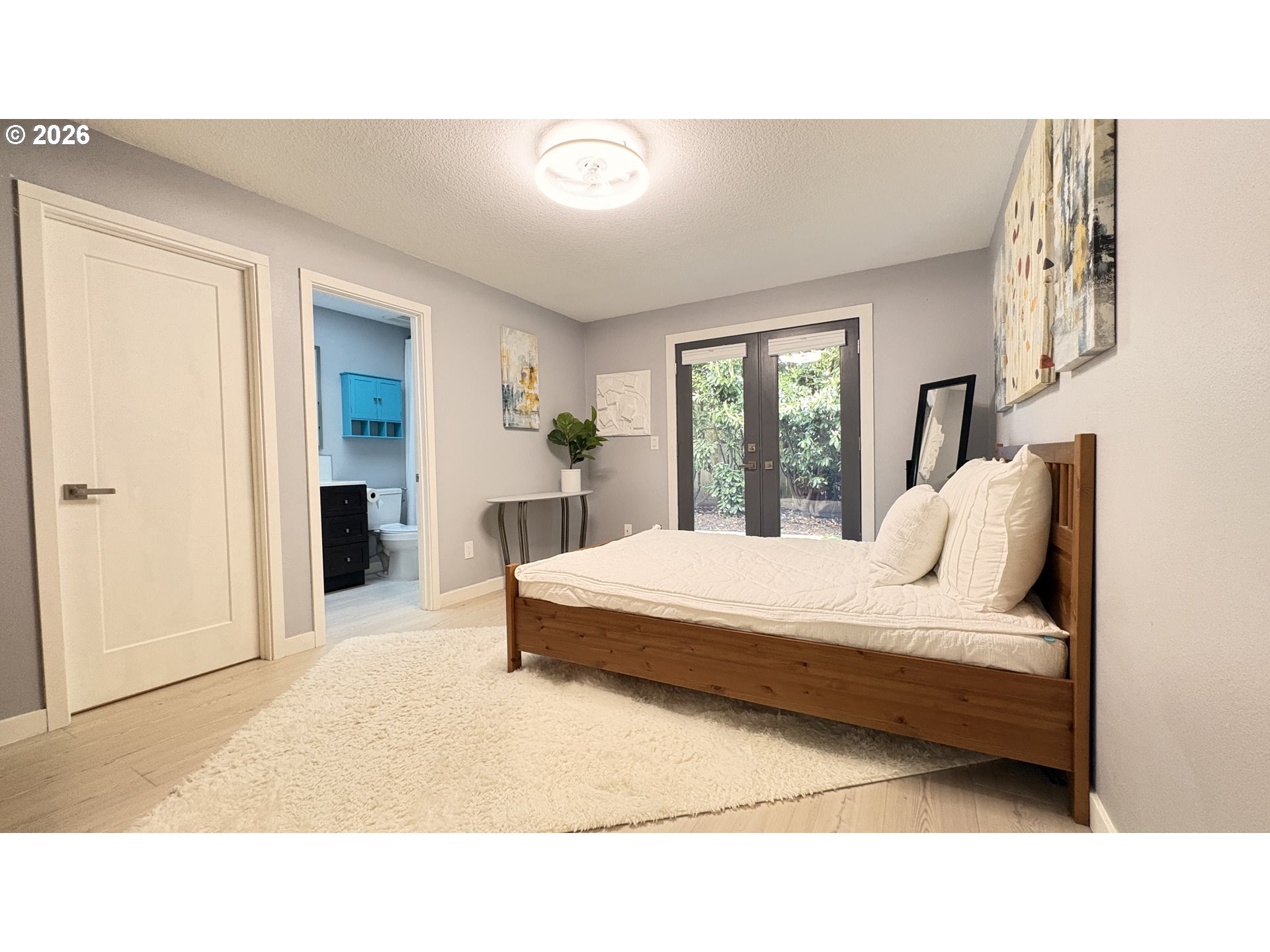 6650 Southwest Canby Street Portland, OR 97223 - Photo 24 of 34 a bedroom with a bed and window