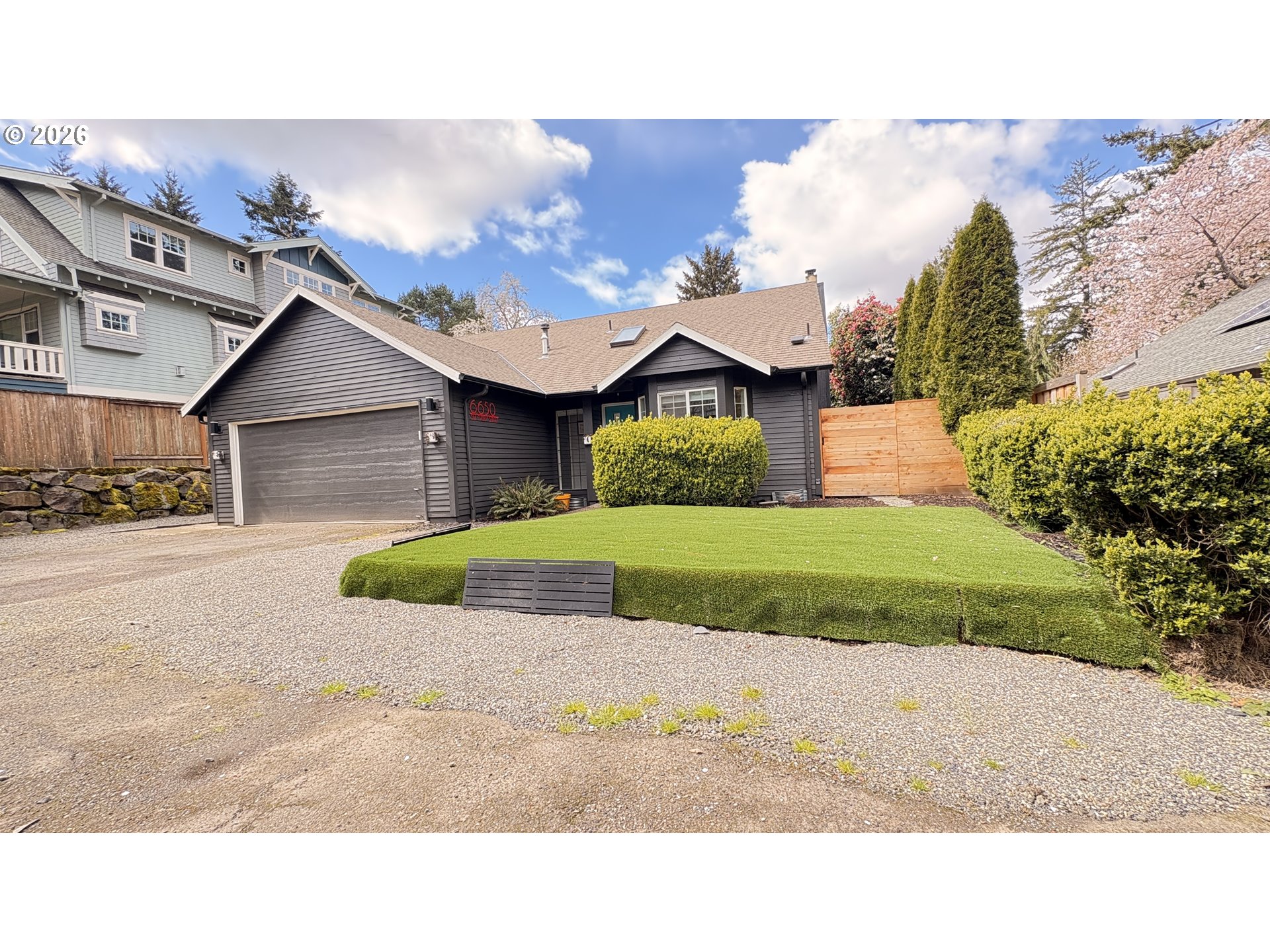 6650 Southwest Canby Street Portland, OR 97223 - Photo 33 of 34 a house view with a garden space