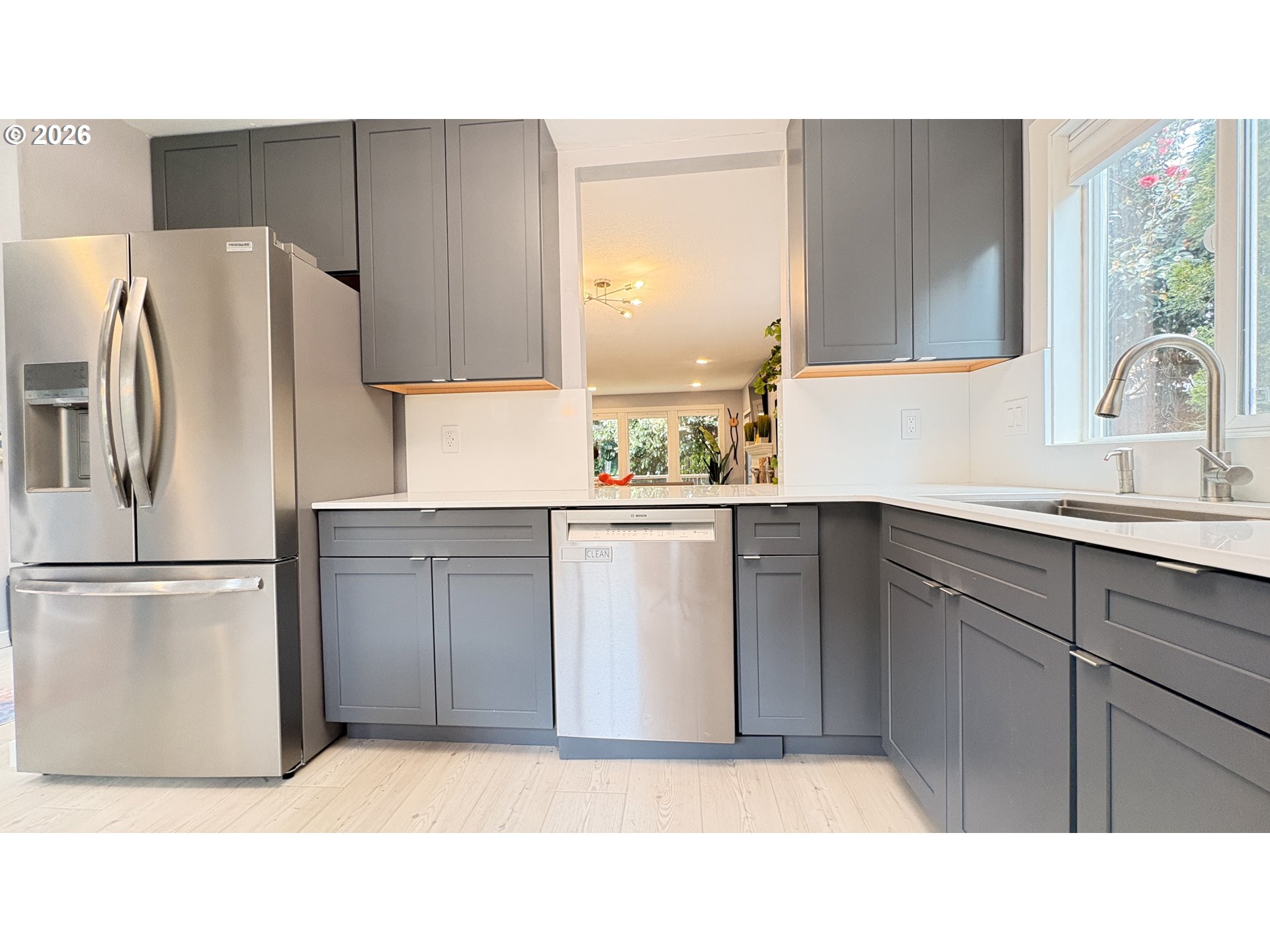 6650 Southwest Canby Street Portland, OR 97223 - Photo 7 of 34 a kitchen with a refrigerator sink and cabinets