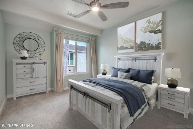 a bedroom with a bed a dresser and chair