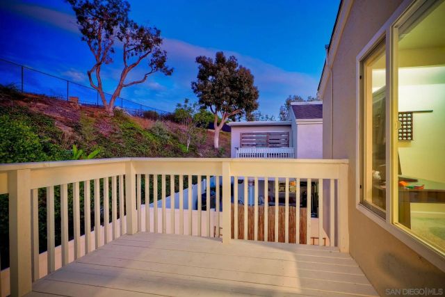 a view of a two chairs on the side of a building