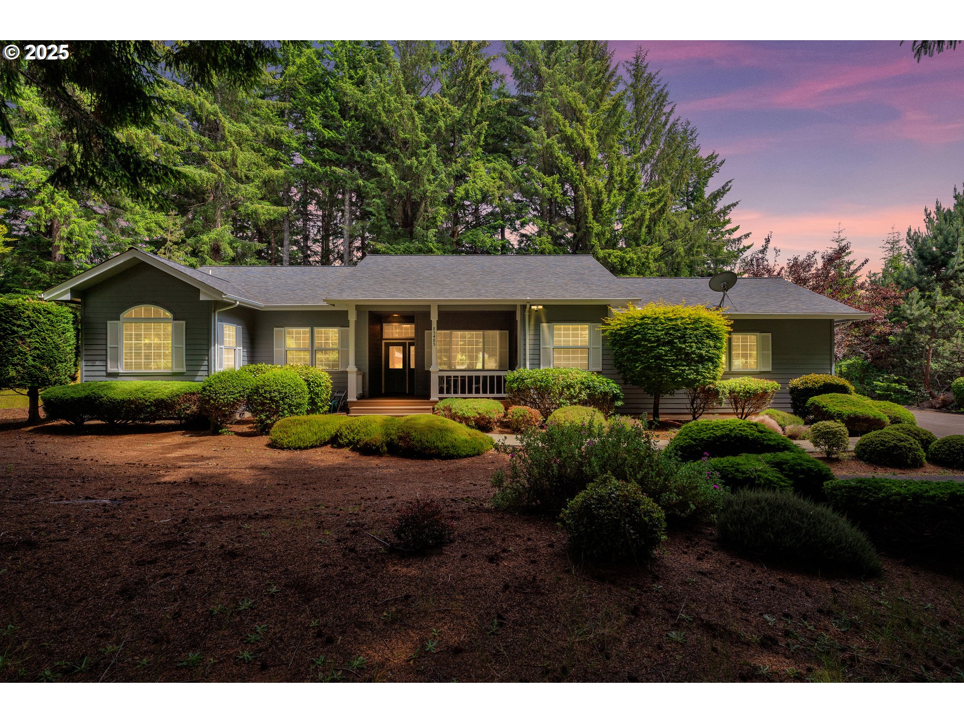 a view of a front of house with a garden