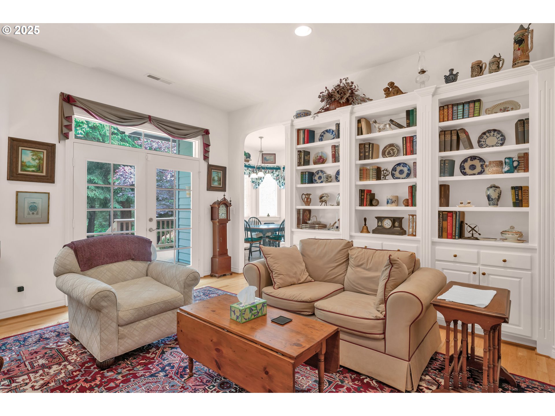 83485 Clear Lake Road Florence, OR 97439 - Photo 11 of 47 a living room with furniture and a book shelf