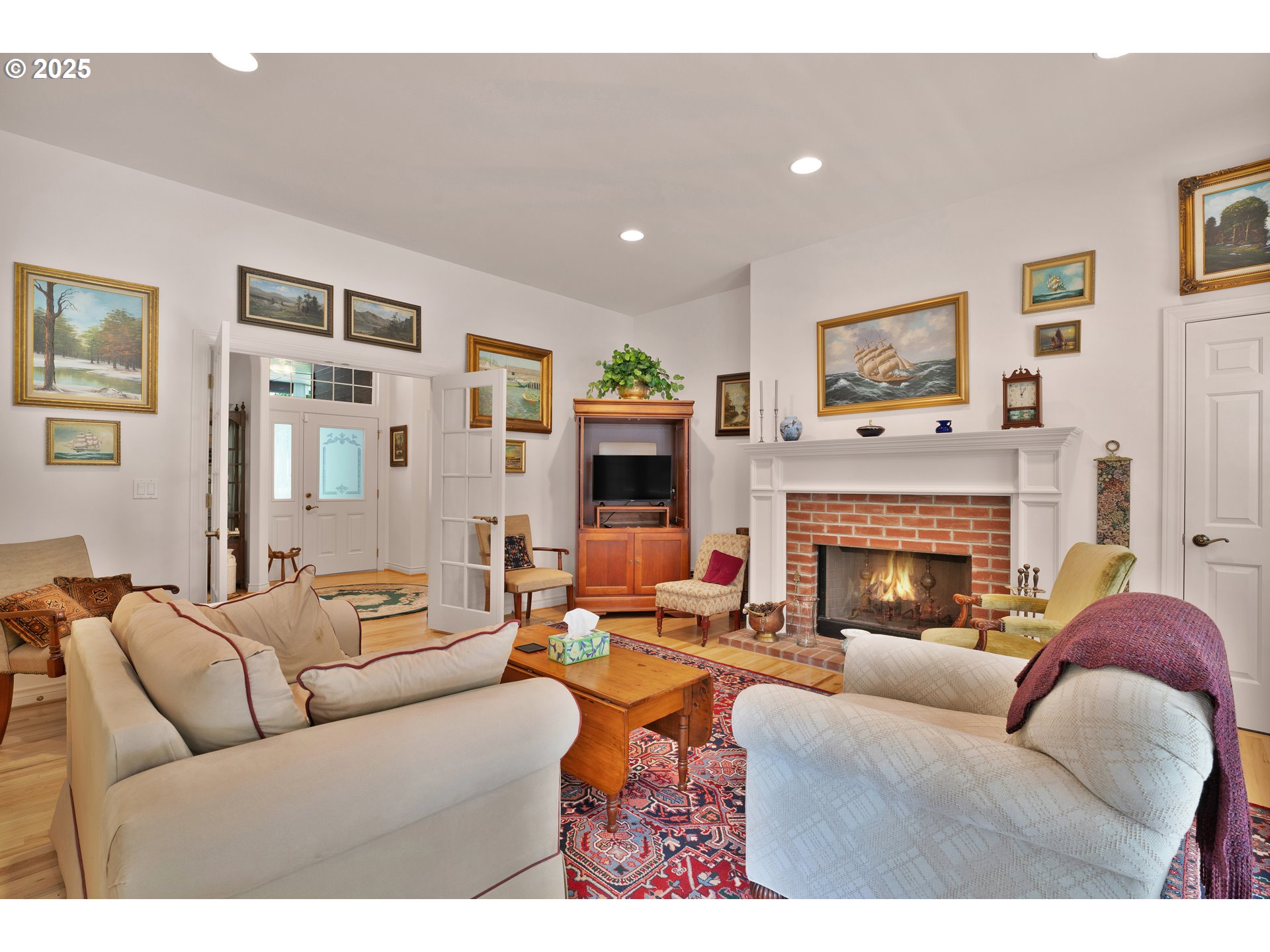 83485 Clear Lake Road Florence, OR 97439 - Photo 13 of 47 a living room with furniture large window and a fireplace