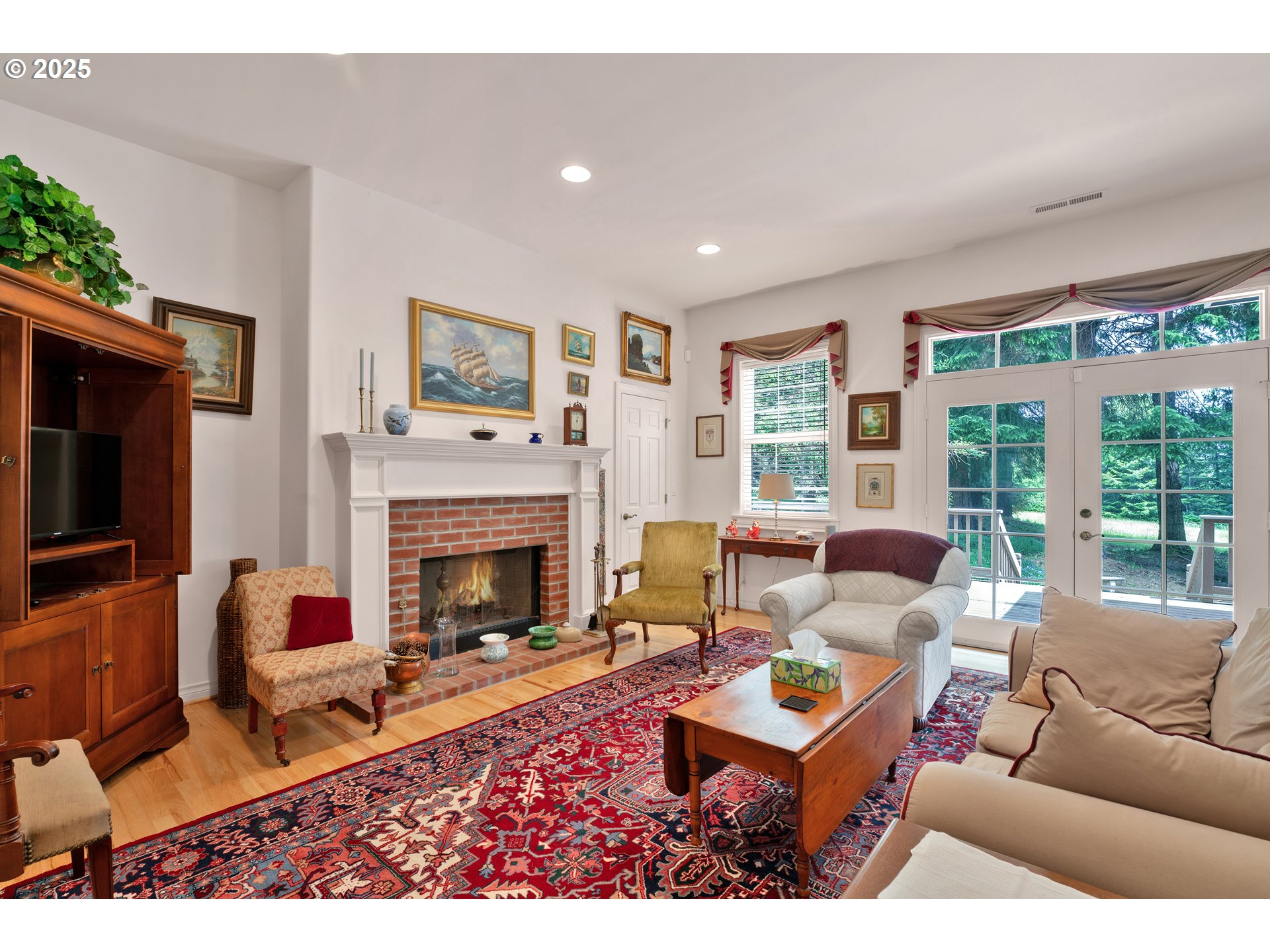 83485 Clear Lake Road Florence, OR 97439 - Photo 14 of 47 a living room with furniture a flat screen tv and a fireplace