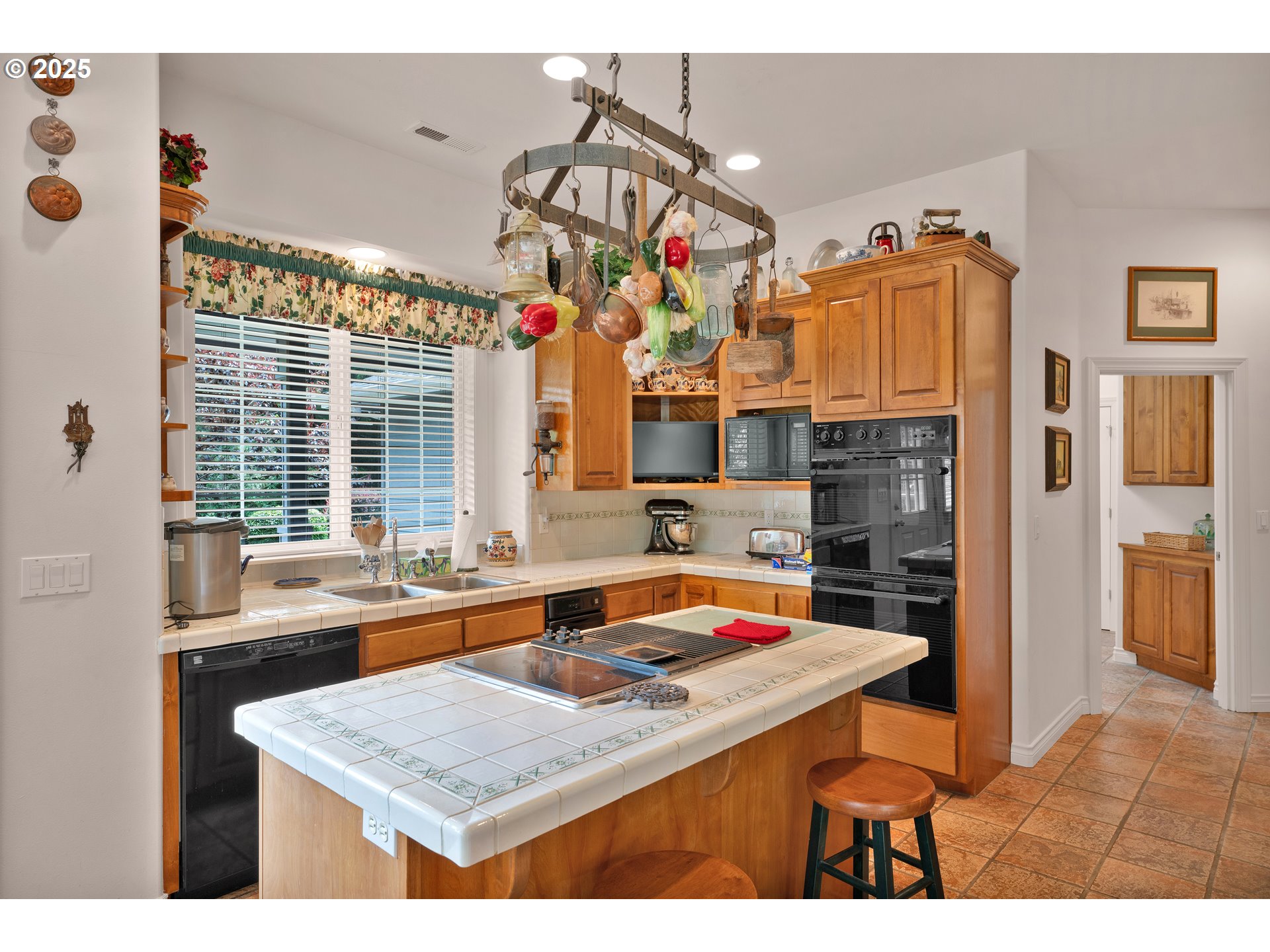 83485 Clear Lake Road Florence, OR 97439 - Photo 15 of 47 a kitchen that has a lot of cabinets a sink and a wooden floor