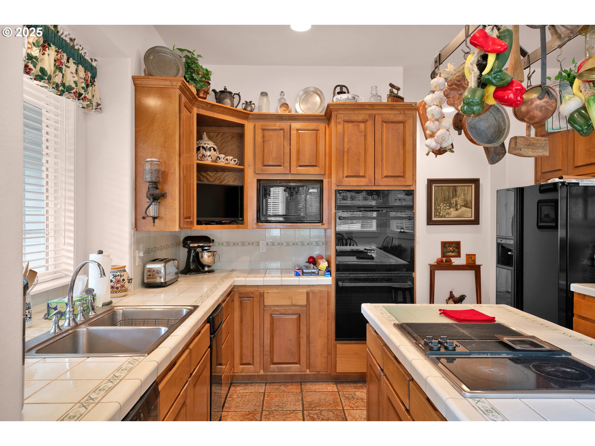 83485 Clear Lake Road Florence, OR 97439 - Photo 16 of 47 a kitchen view of a kitchen island a sink stainless steel appliances and cabinets