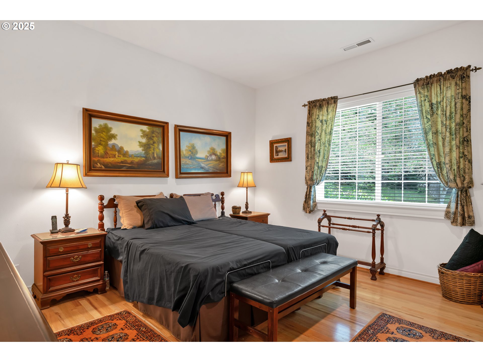 83485 Clear Lake Road Florence, OR 97439 - Photo 25 of 47 a bedroom with a bed and a table with lamp