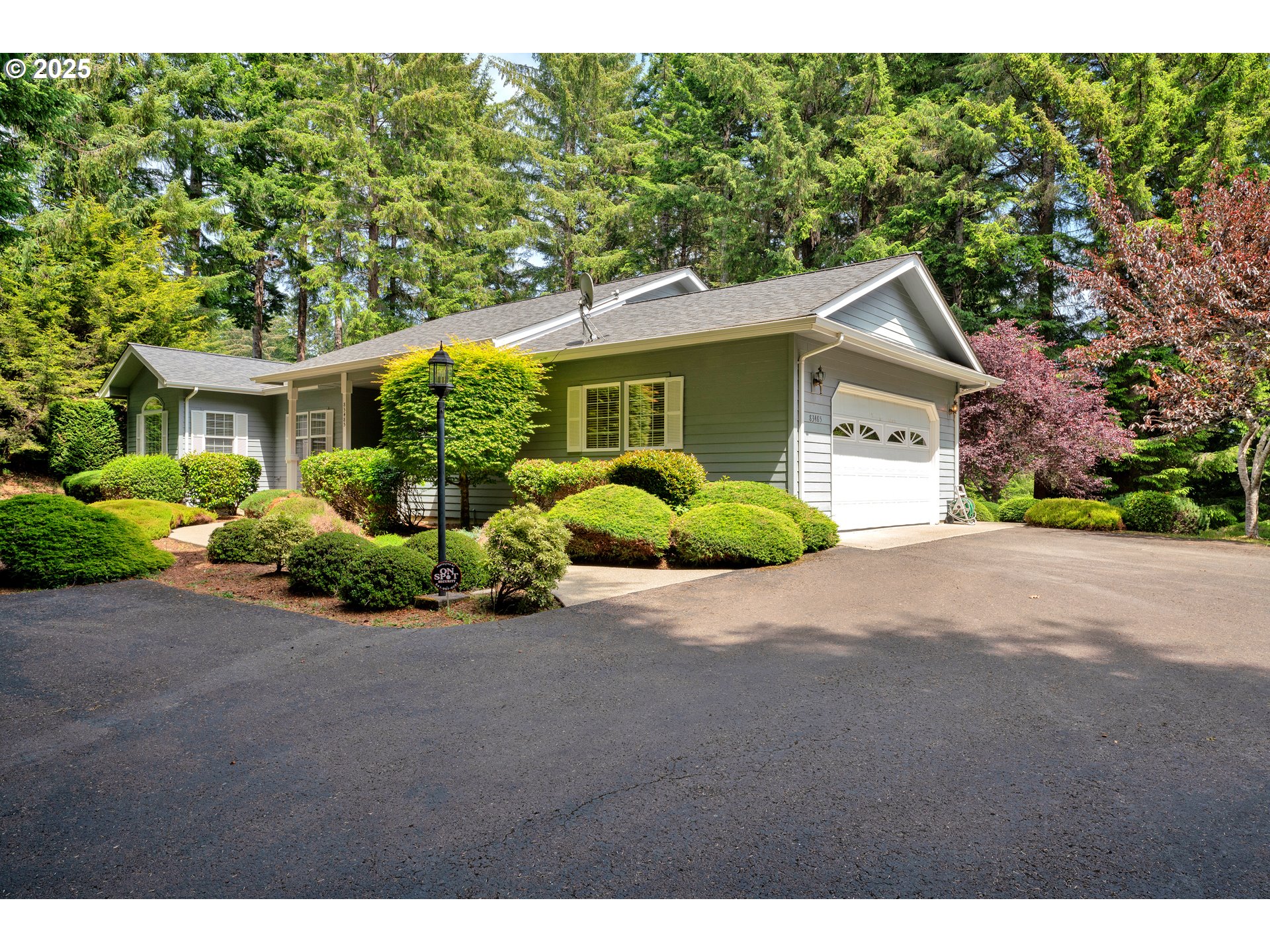83485 Clear Lake Road Florence, OR 97439 - Photo 5 of 47 a front view of a house with a garden