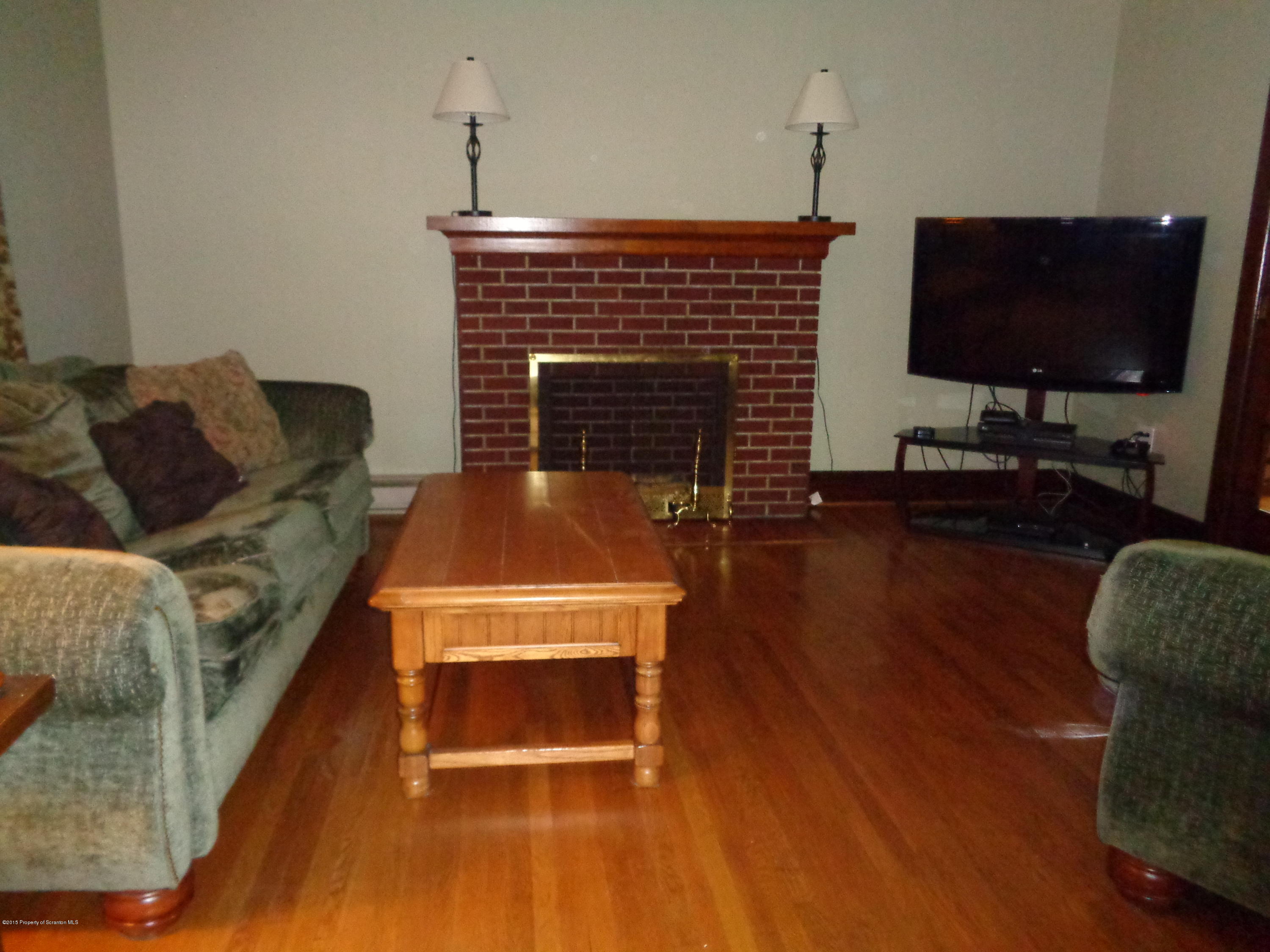 1911 Green Ridge Street Dunmore, PA 18512 - Photo 6 of 16 a living room with furniture and a flat screen tv