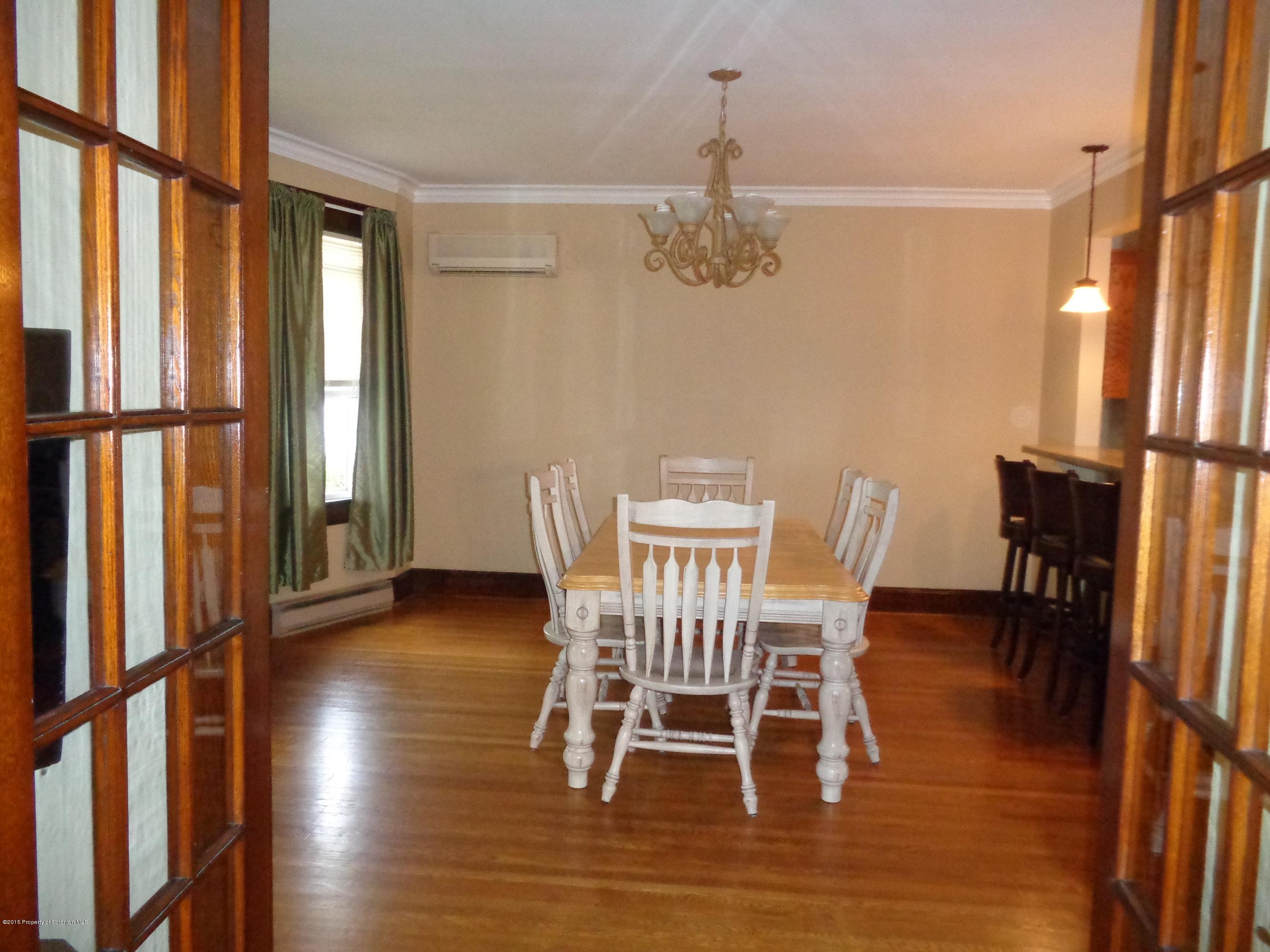 1911 Green Ridge Street Dunmore, PA 18512 - Photo 7 of 16 a view of a dining room with furniture window and wooden floor