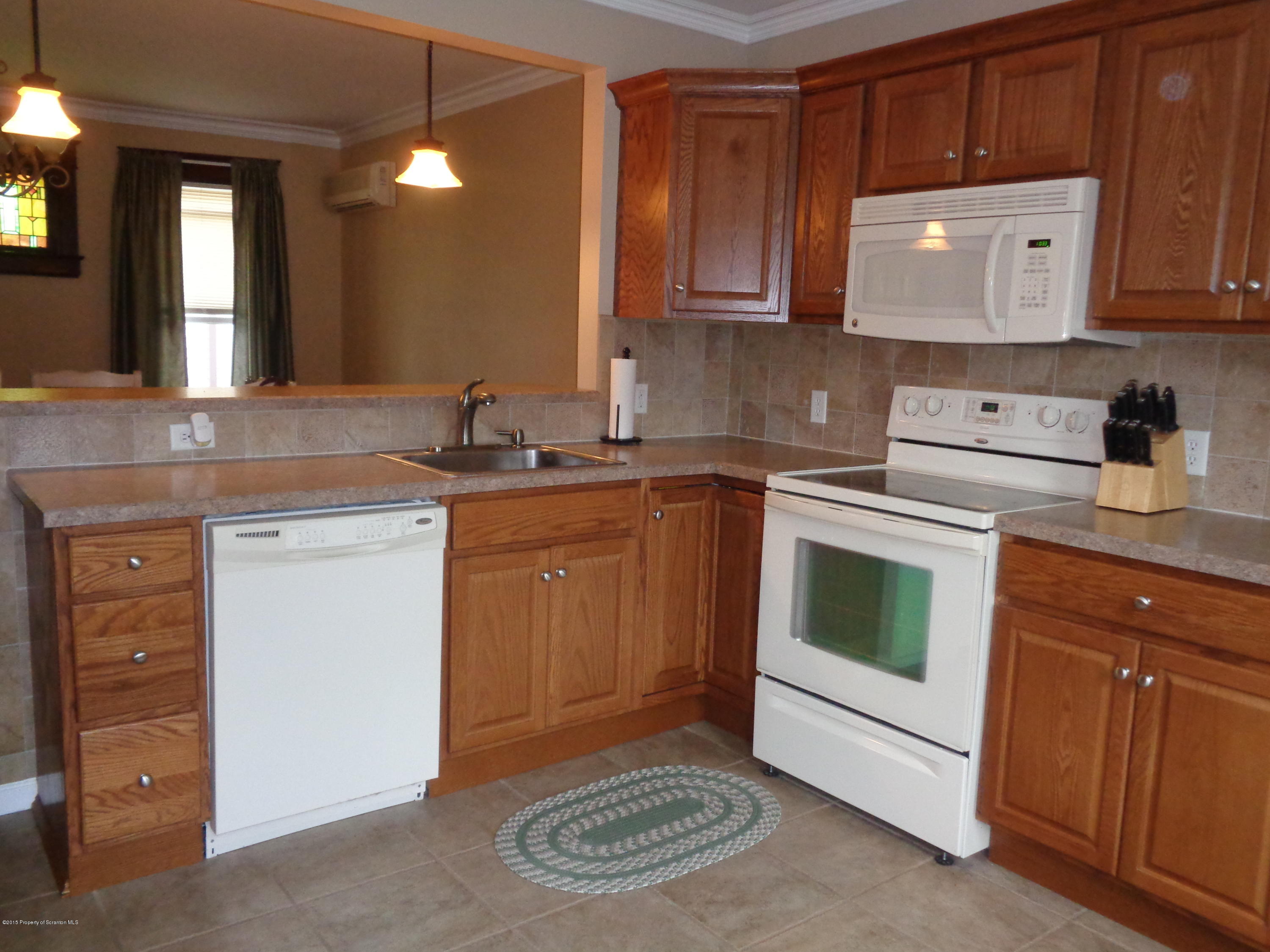 1911 Green Ridge Street Dunmore, PA 18512 - Photo 9 of 16 a kitchen with a sink cabinets and appliances