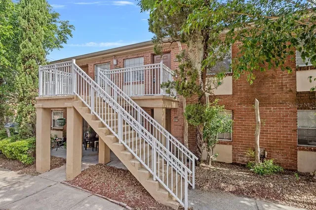 a view of a house with wooden stairs
