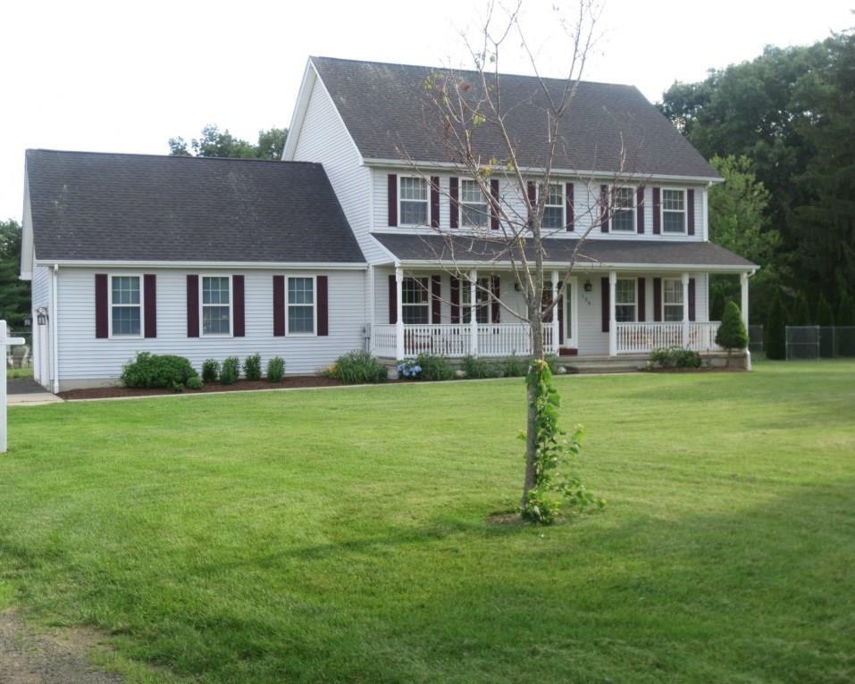 front view of a house with a yard