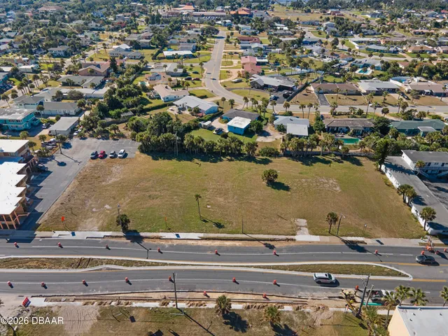 an aerial view of a house with outdoor space