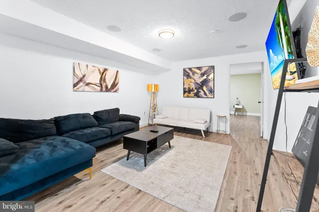 a living room with furniture and a rug