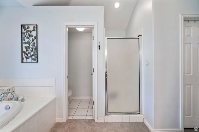 357 South 320 W Street Lindon, UT 84042 - Photo 13 of 41 Bathroom featuring a white tiled soaking tub, a frosted glass shower enclosure, and recessed lighting