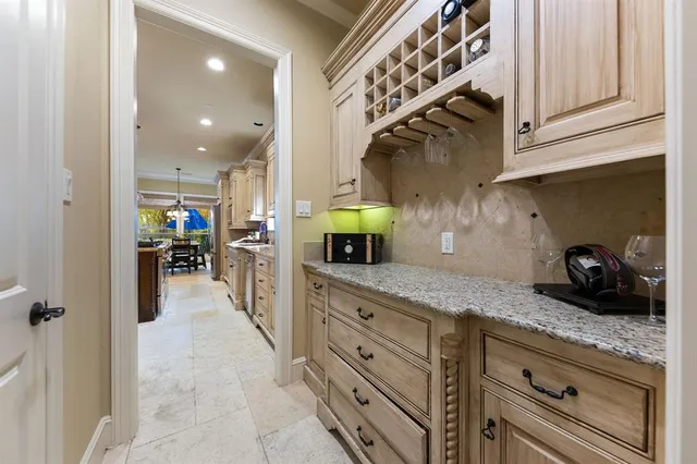 a kitchen with stainless steel appliances granite countertop a sink and cabinets