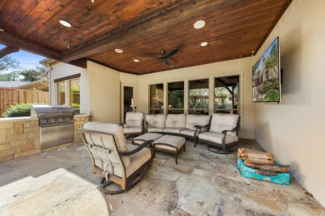 a building outdoor space with patio furniture and potted plants