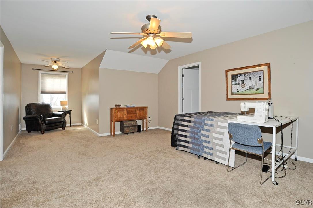 1056 Bushkill Center Road Wind Gap, PA 18091 - Photo 23 of 28 a living room with furniture and a chandelier